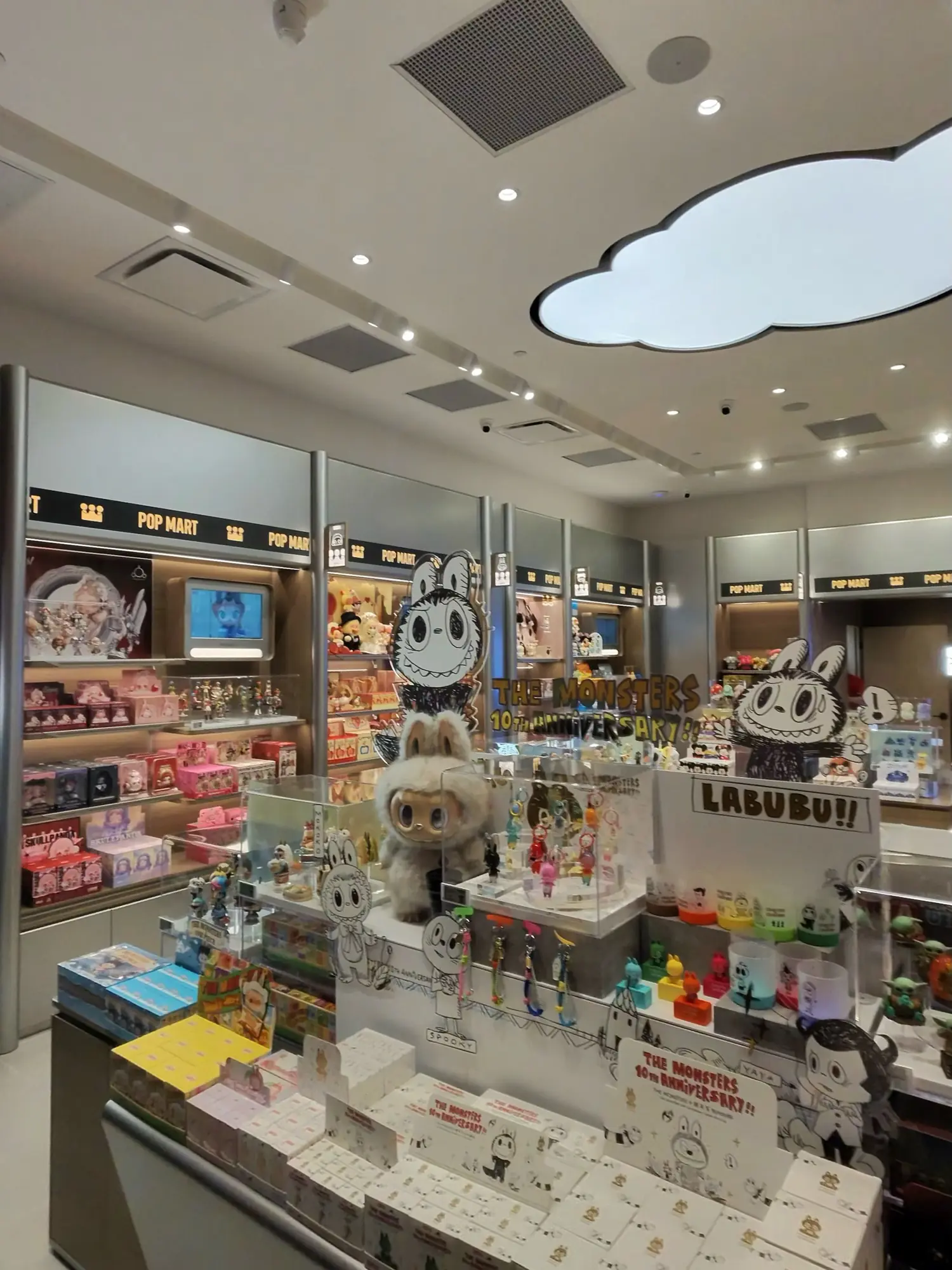 The same Pop Mart, finished and stocked under the cloud light.
